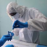 Scientist picking a research sample