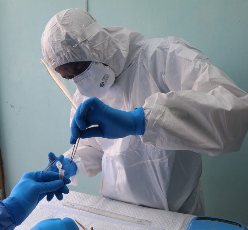 Scientist picking a research sample